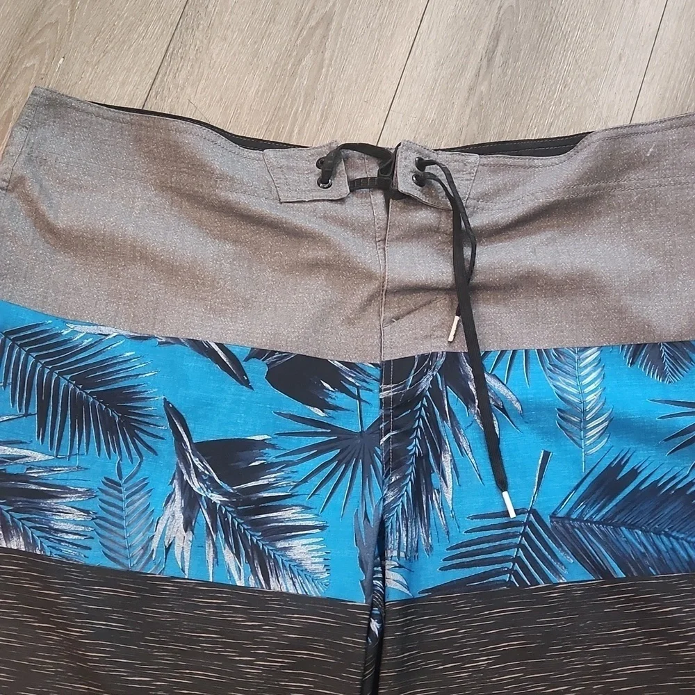 O'Neill Gray and Blue Board Shorts with Tropical Print